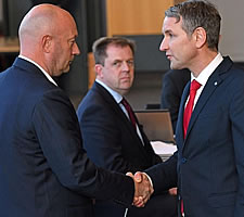 Now wash your hands. The newly elected Thomas Kemmerich receiving the congratulations of Björn Höcke, the leader of the AfD in Thuringen. Kemmerich is not even wearing a facemask or rubber gloves, let alone the obligatory hazmat suit. He will not survive this encounter.
